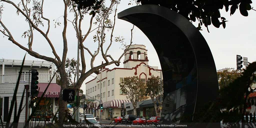 Through the trees shot of downtown Laguna Beach, California.